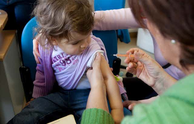 A child gets a vaccination.