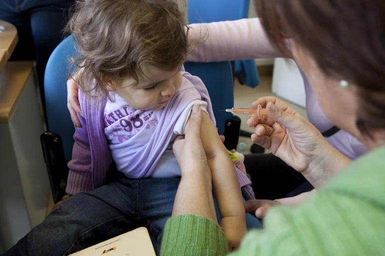 A child gets a vaccination.