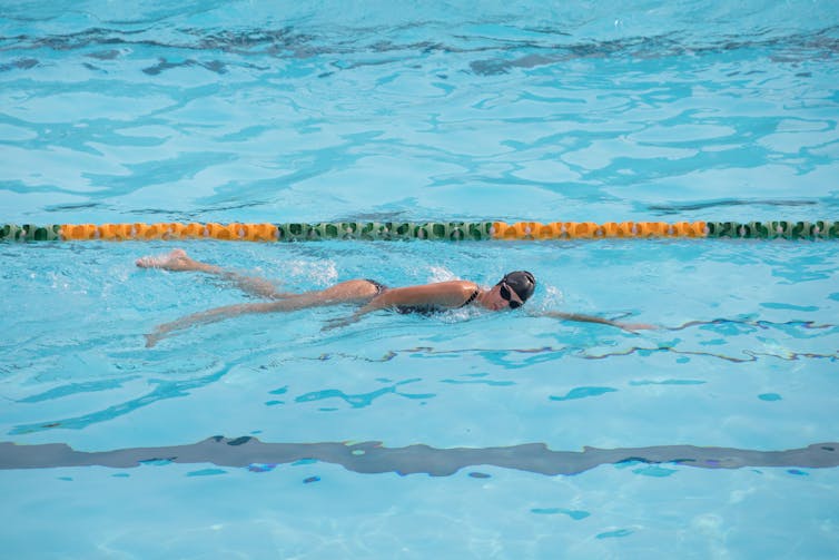 A person swims laps in a pool.
