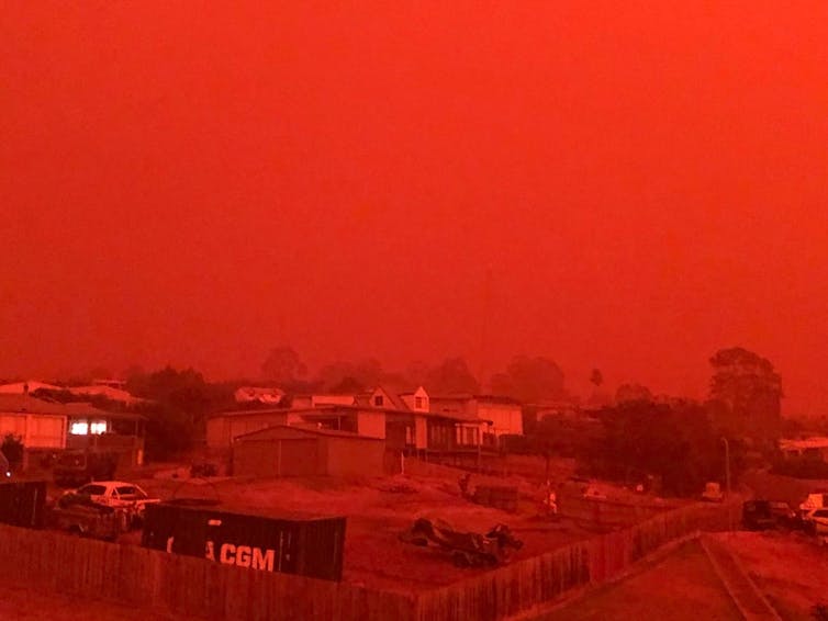 A sky looks red due to bushfire smoke.