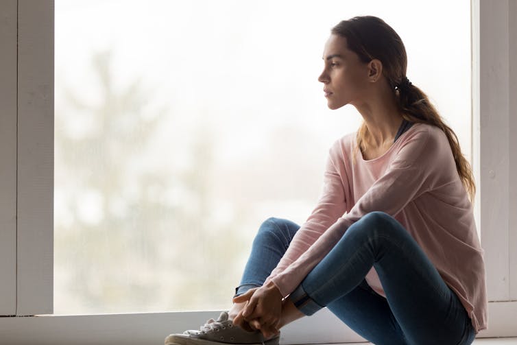 Woman looking out a window