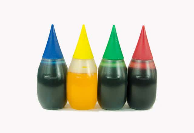 Close-up of bottles of food coloring