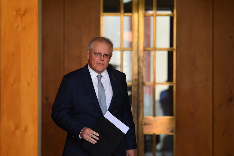 Prime Minister Scott Morrison arriving for a press conference in his Parliament House courtyard.