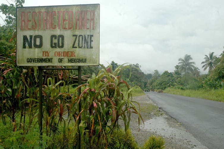 A sign by the road that reads 'no go zone'.