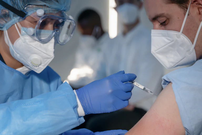Picture of a patient being vaccinated.