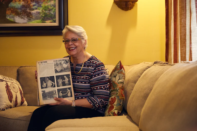 Jeanette W. Jones holds a copy of the September 1957 issue of Ebony magazine,
