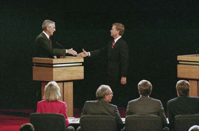 Bentsen and Quayle shake hands on the debate stage
