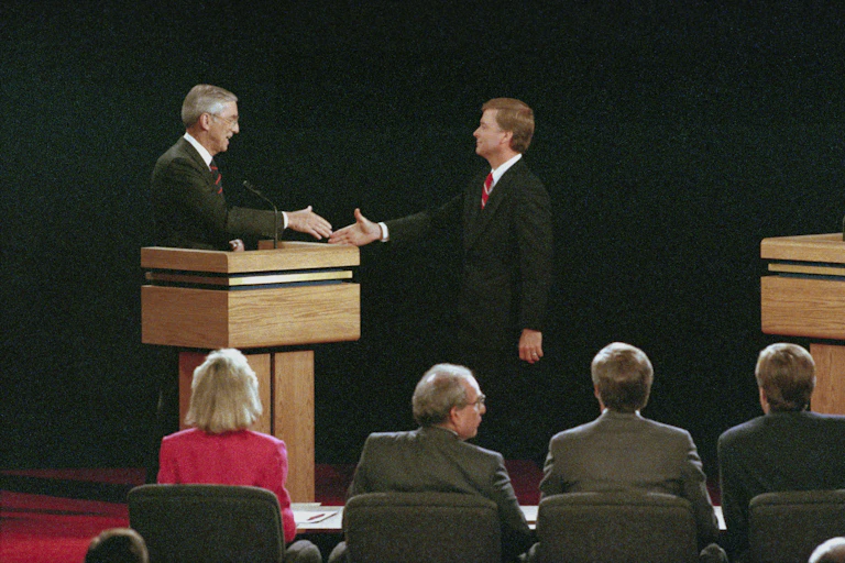 Bentsen and Quayle shake hands on the debate stage