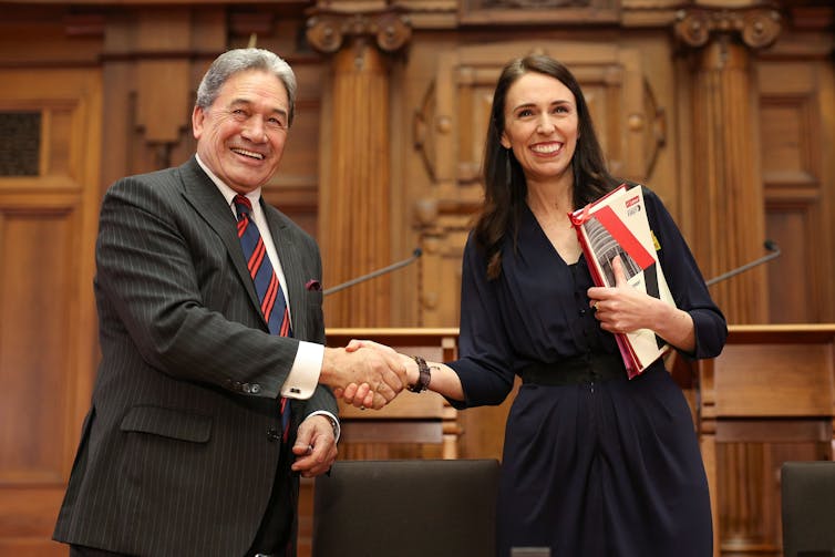 man and woman shaking hands