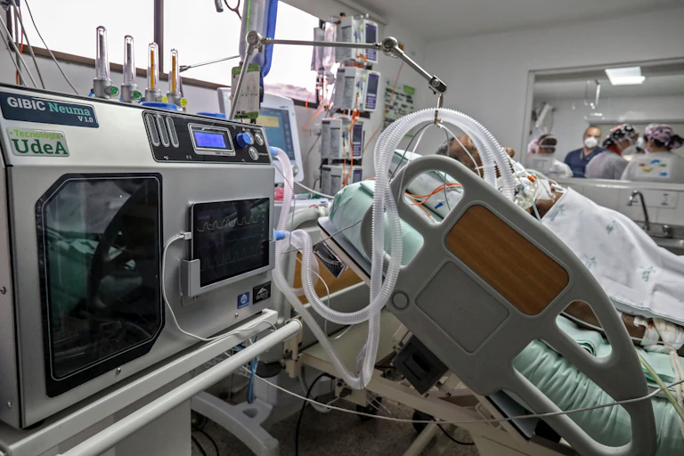 Man in hospital on a ventilator