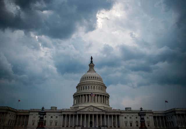 Clouds gather over the U.S. Capitol building.