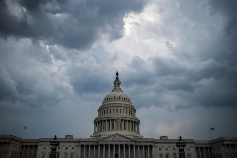 Clouds gather over the U.S. Capitol building.