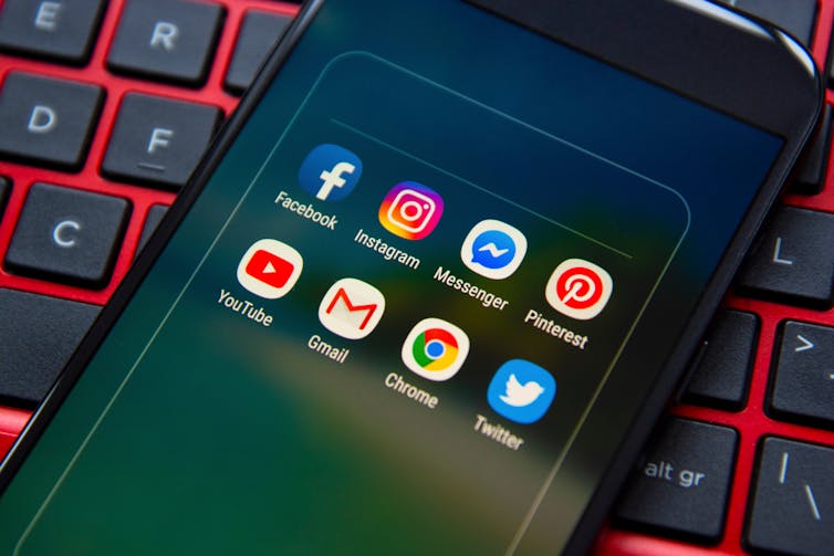 Social media icons on smartphone.