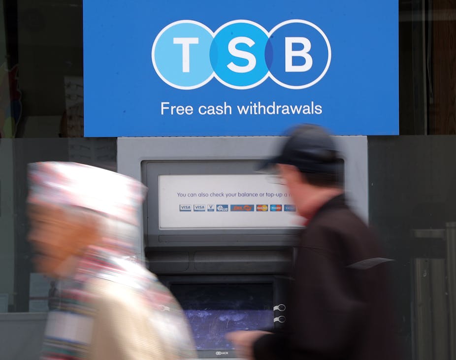 Two people outside a TSB ATM