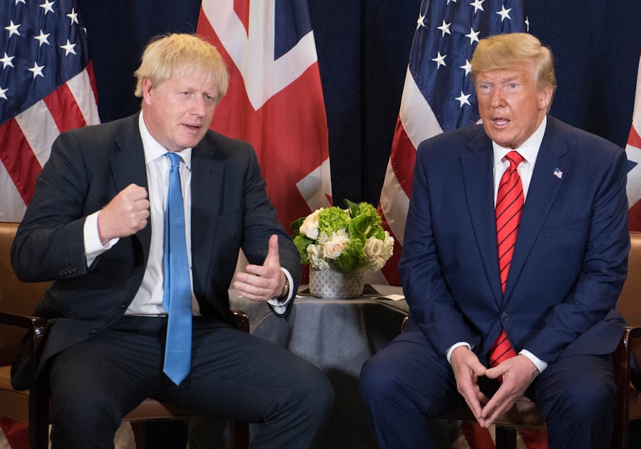 Boris Johnson and Donald Trump sitting with UK and US flags behind.