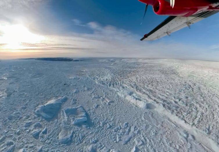 An aerial view of the edge of the large Jakobshvan Glacier, where ice breaks off into the sea.