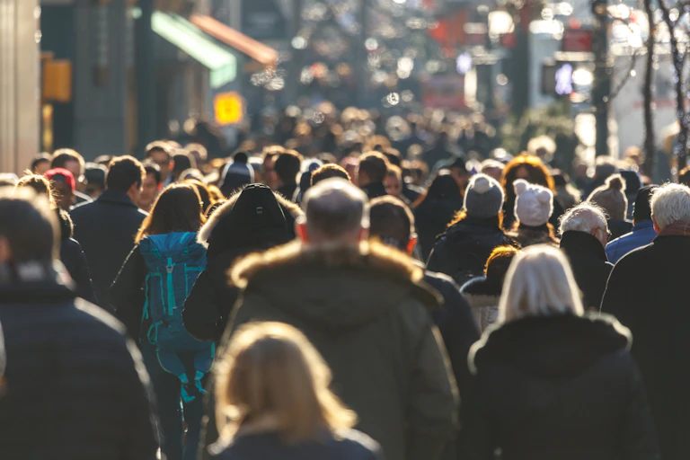 A crowded street, filled with pedestrians