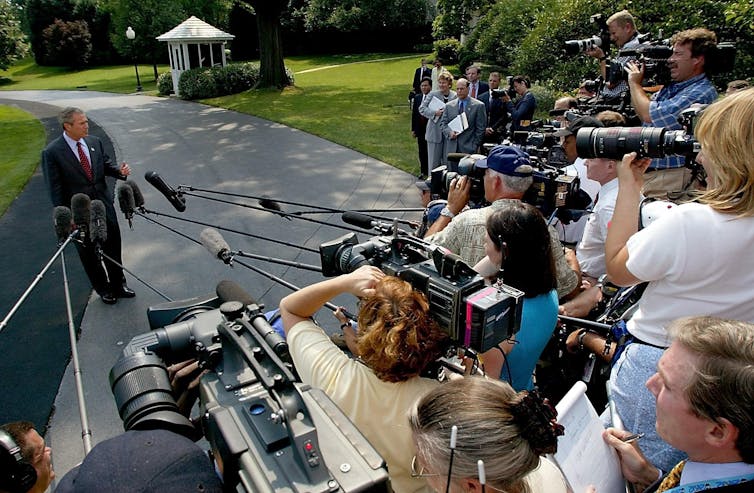 President George W. Bush speaking to the press.