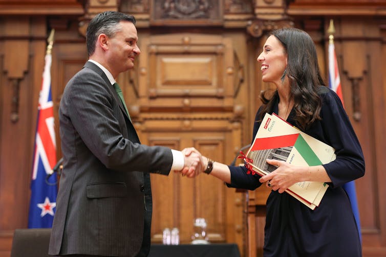 man and woman shaking hands