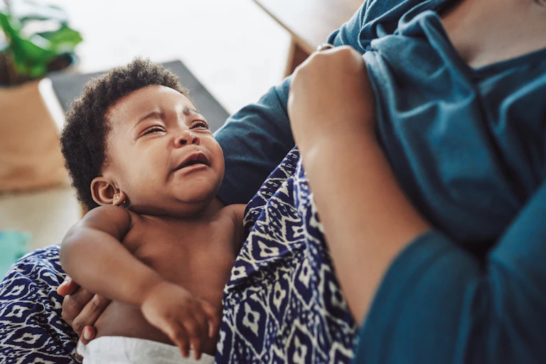 a woman breastfeeding her child
