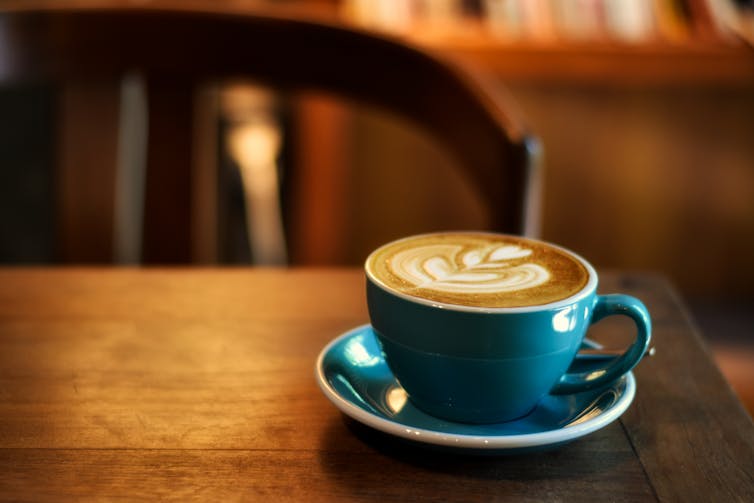 A cup of coffee on a wooden table