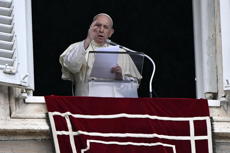 Pope Francis leads his Sunday Angelus prayer from the window of his office overlooking Saint Peter's Square, Vatican City, Italy, 04 October 2020.