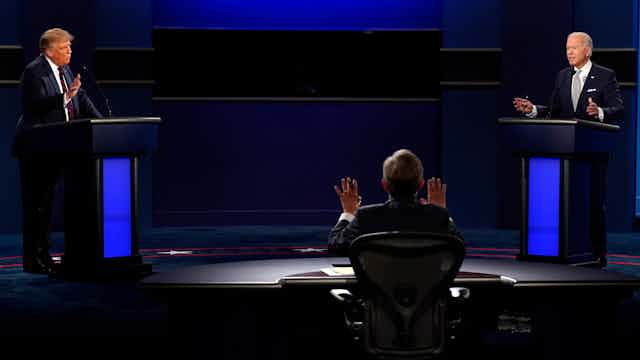 Moderator Chris Wallace, President Trump and  Joe Biden speak over each other during the first presidential debate