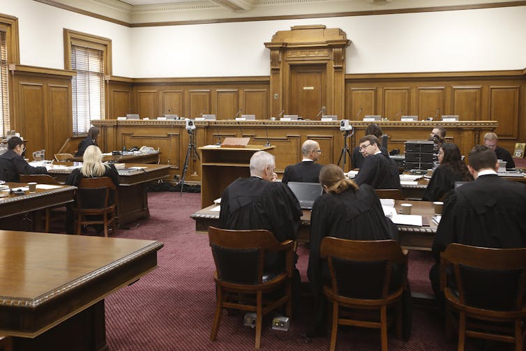 An image of a courtroom with a raised judges' platform.