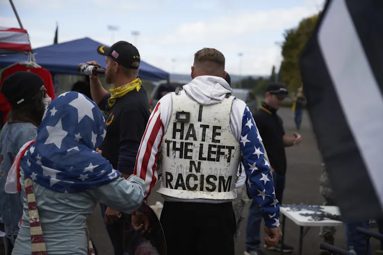 A man wears an 'I Hate the Left' protective vest at a Proud Boys rally in Delta Park, in Portland, Oregon, US