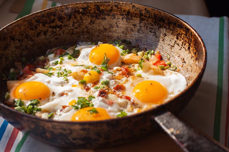 Fried eggs in a pan.