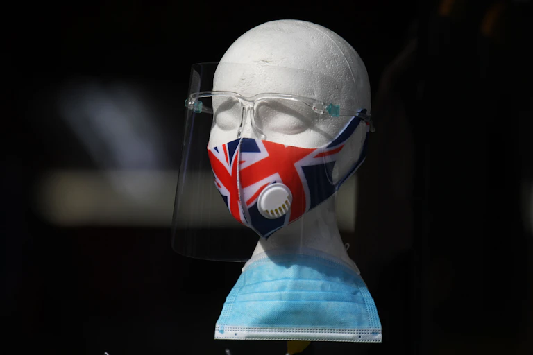 A union jack mask displayed on a styrofoam model of a head.