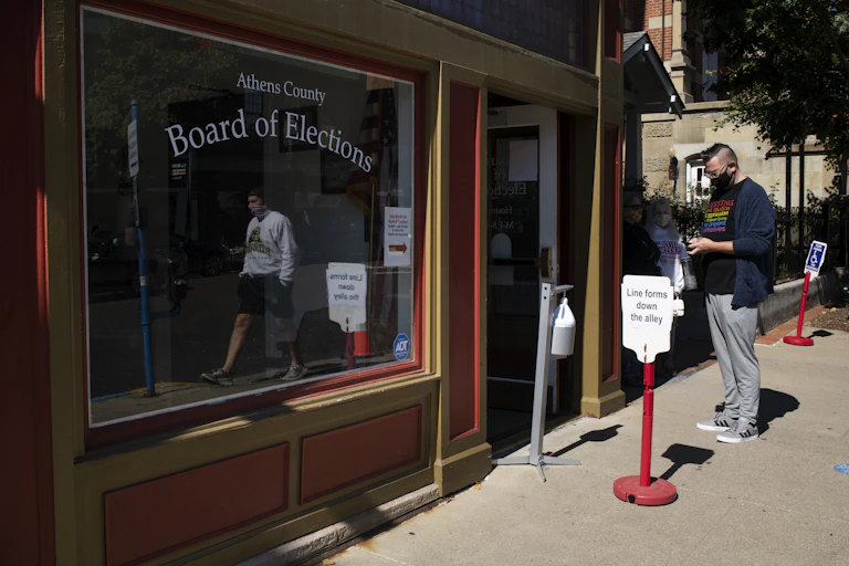 Early voters wait in line outside the Athens County Board of Elections Office on October 6, 2020 in Athens, Ohio