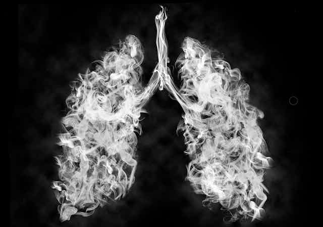 A photo illustration of smoke forming the shape of lungs.