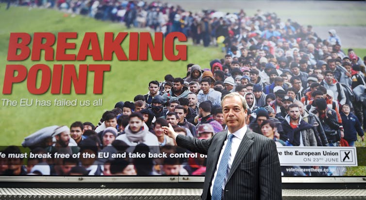Nigel Farage stood in front of 'breaking point' anti-immigration poster.