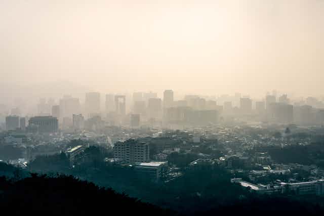 Skyline view of a city polluted by fine dust.