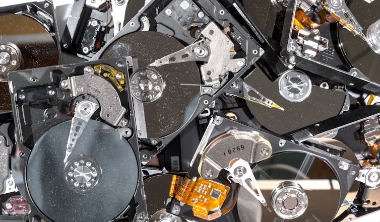 A pile of discarded computer hard drives.