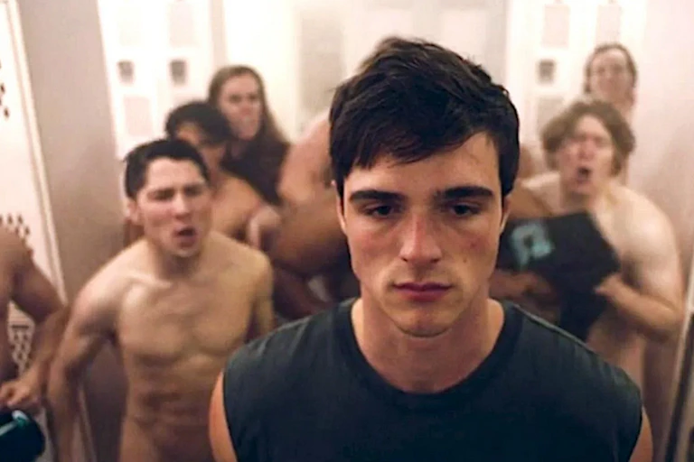 Naked teens jeer at one of their classmates in a locker room in a scene from 'Euphoria.'