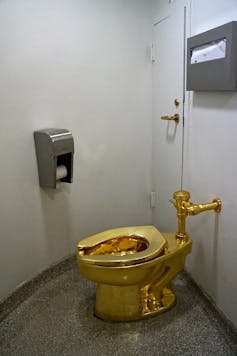 A gold toilet.