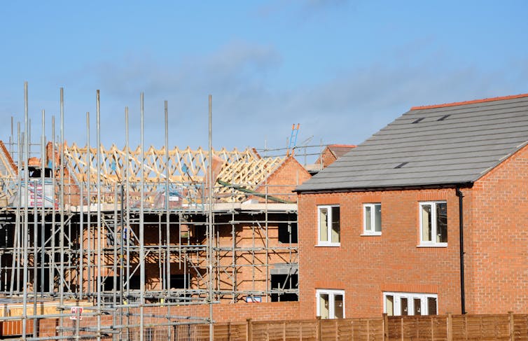 Construction site of red brick houses.