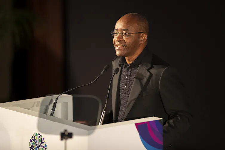 Zimbabwean tech billionaire Strive Masiyiwa speaking at a conference.