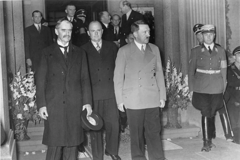 Neville Chamberlain and Adolf Hitler accompanied by various aides in Bad Godesberg in 1938.