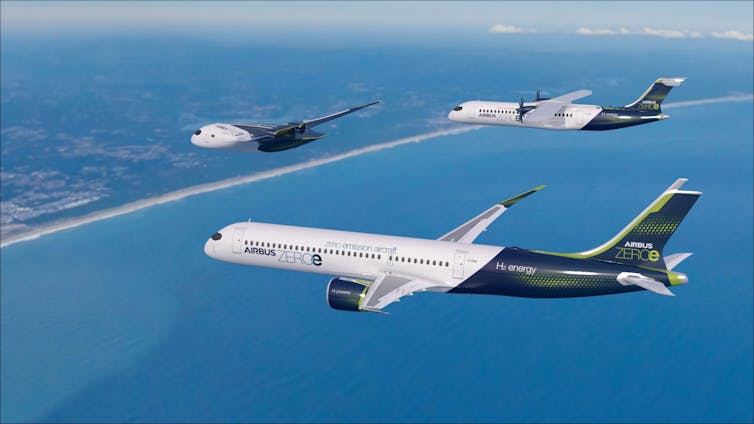 Three aeroplanes of different designs fly in formation.