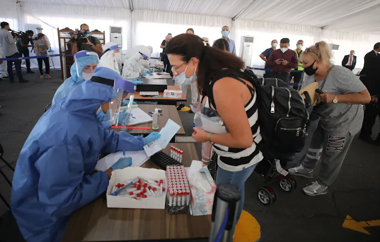 Tourists being screened for COVID-19 at Sharm el-Sheikh International Airport, Egypt.