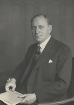 Painting of a middle-aged man in a suit holding a book.
