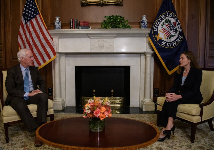 Barrett and Sen. John Cornyn are seen sitting in his office on Capitol Hill on Sept. 30.