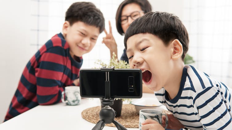 A family makes a video call together.