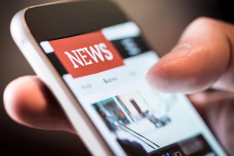 Close up of newsfeed on a phone