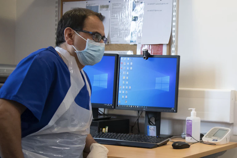 A GP and a patient in an appointment