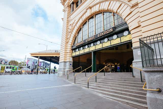 The steps of Flinders Street Station are depicted deserted.