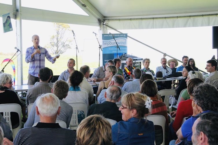 People attend a community meeting